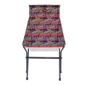 The Big Agnes Returns Big Six Camp Chair - Alpenglow is a lightweight, packable camp chair with a black metal frame and a colorful seat featuring a vibrant abstract mountain landscape in red, purple, blue, and orange.