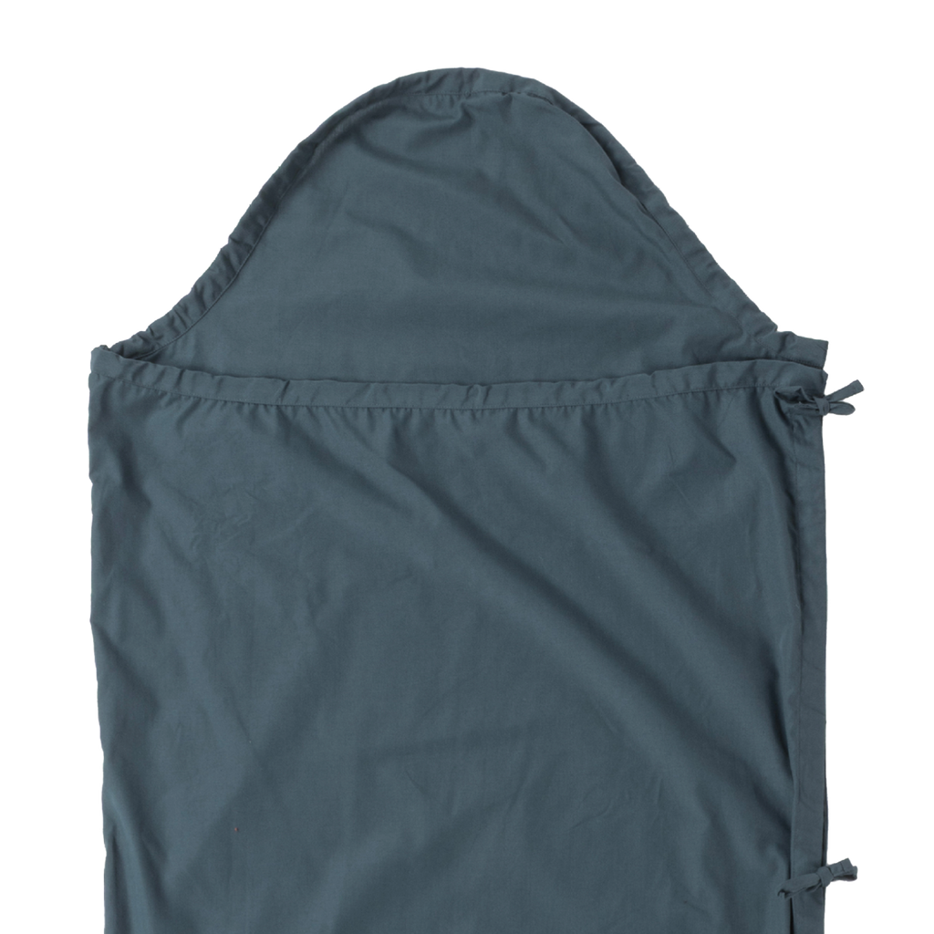 The Big Agnes Cotton Sleeping Bag Liner in dark blue features a hood, smooth texture, and side ties. Shown flat on a light background, this simple design makes it an ideal travel companion.