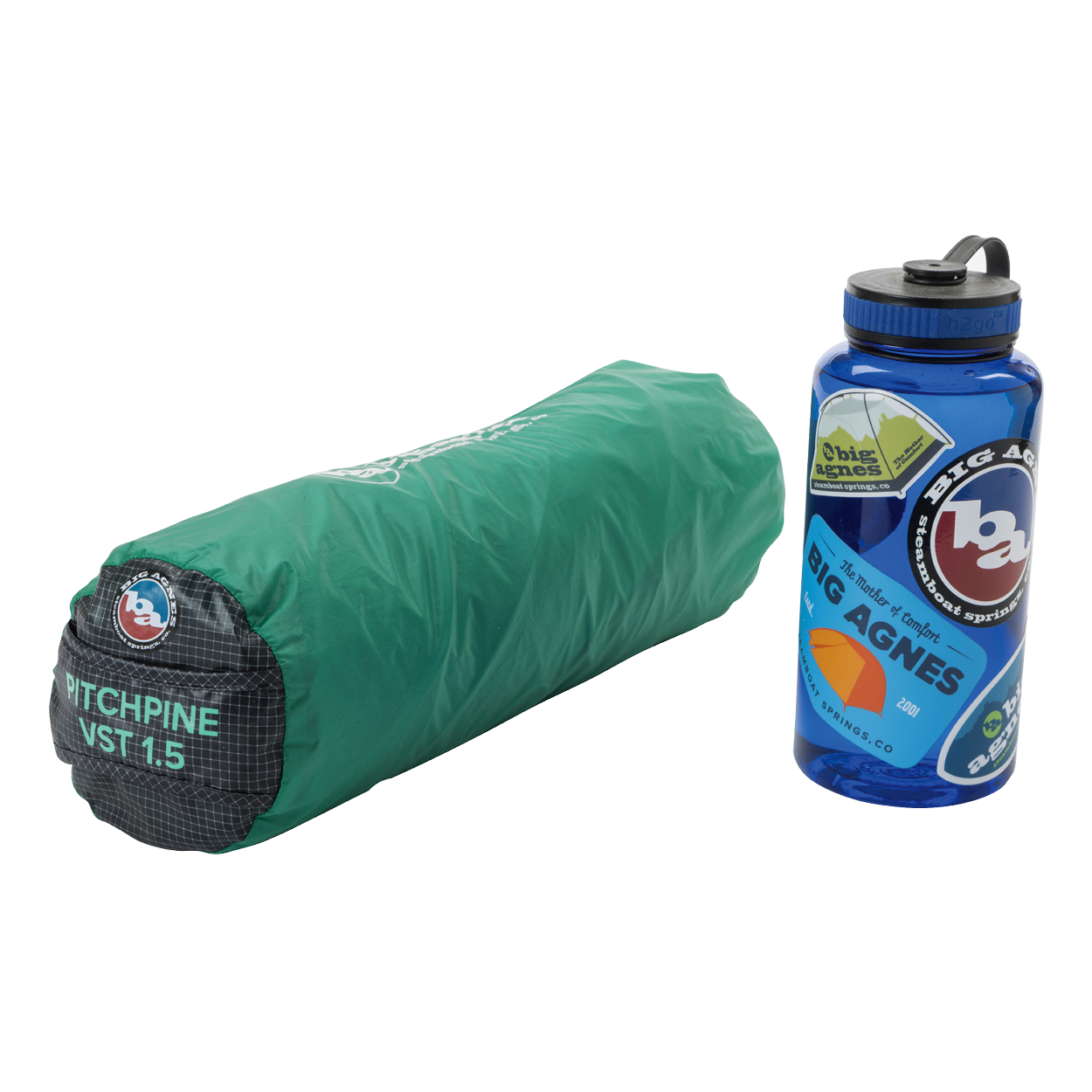 A rolled-up green Big Agnes Pitchpine VST 1.5 ultralight shelter sits next to a blue water bottle decorated with Big Agnes stickers.