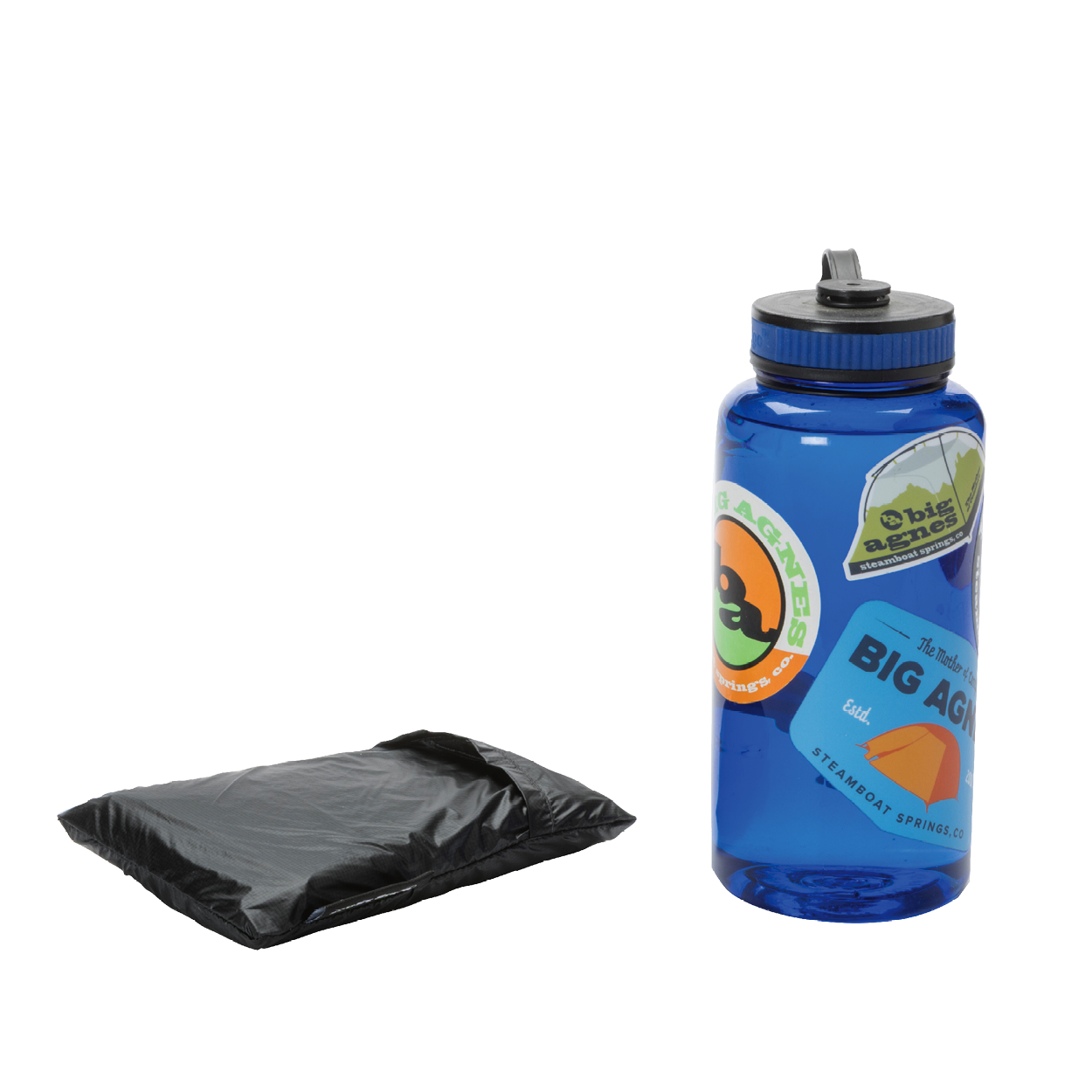 A folded black Pitchpine VST 1.5 Footprint from Big Agnes sits beside a blue water bottle with colorful outdoor-themed stickers, both placed on a plain white background.