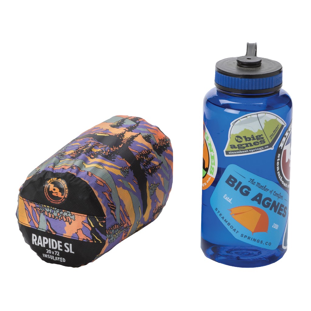 Sleeping bag and water bottle with Big Agnes Returns branding on a white background
