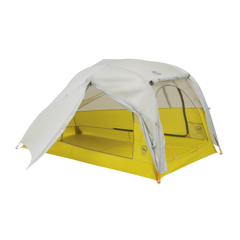 The Big Agnes Salt Creek 2 is a lightweight, two-person backpacking tent with a yellow base, mesh sides for panoramic views, and a light gray rainfly partially covering the top, set up and ready for use.