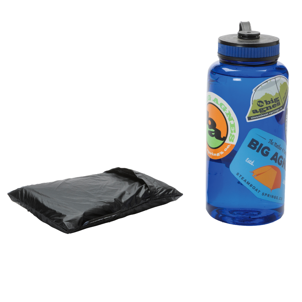A blue water bottle with colorful stickers stands upright beside a folded black Sarvis VST 3 Footprint by Big Agnes Returns, both set against a plain white background.
