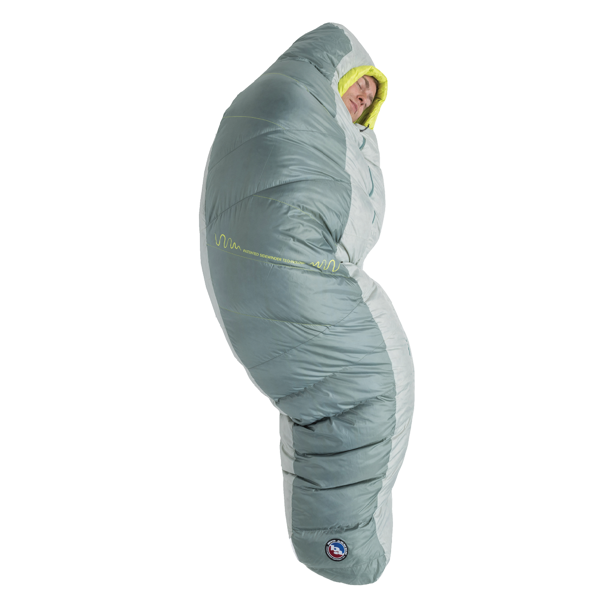 A person stands upright, fully zipped inside the Big Agnes Returns Sidewinder 0˚ sleeping bag in gray and light green, featuring body-mapped insulation with only their face visible.