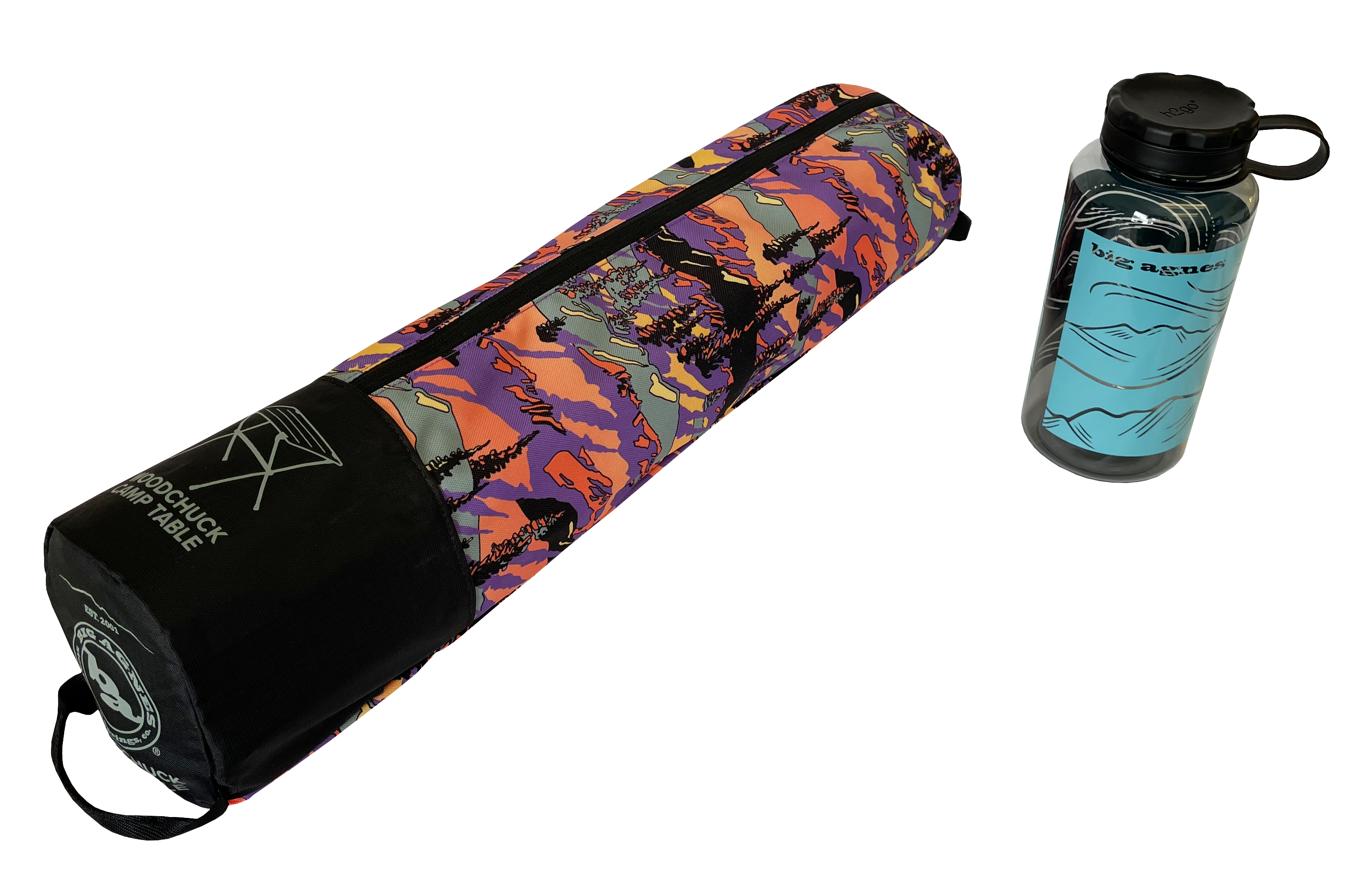 A colorful, patterned carrying case with Big Agnes branding lies next to a clear water bottle with a blue mountain design and black lid—both perfect companions for your Woodchuck Camp Table - Alpenglow adventures.