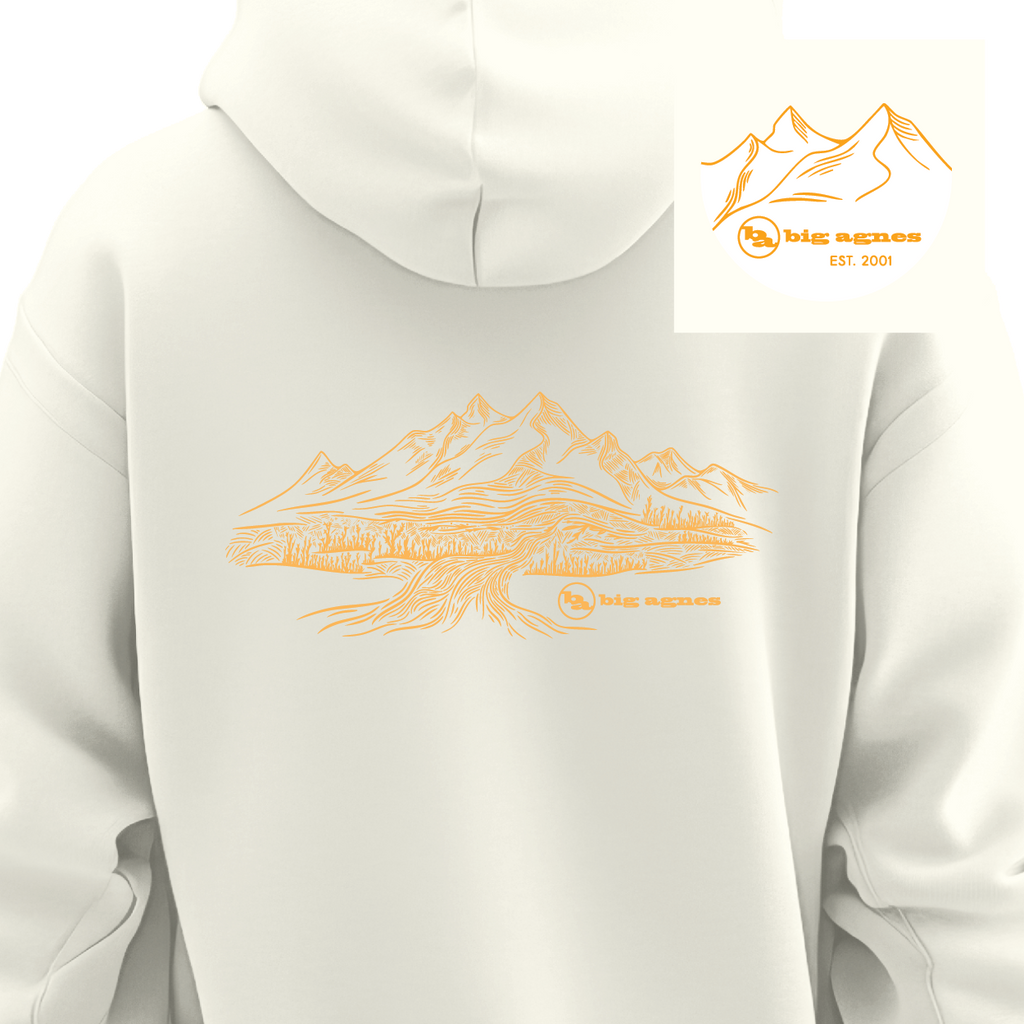 White hoodie with orange mountain graphic and 'big agnes' logo on a white background