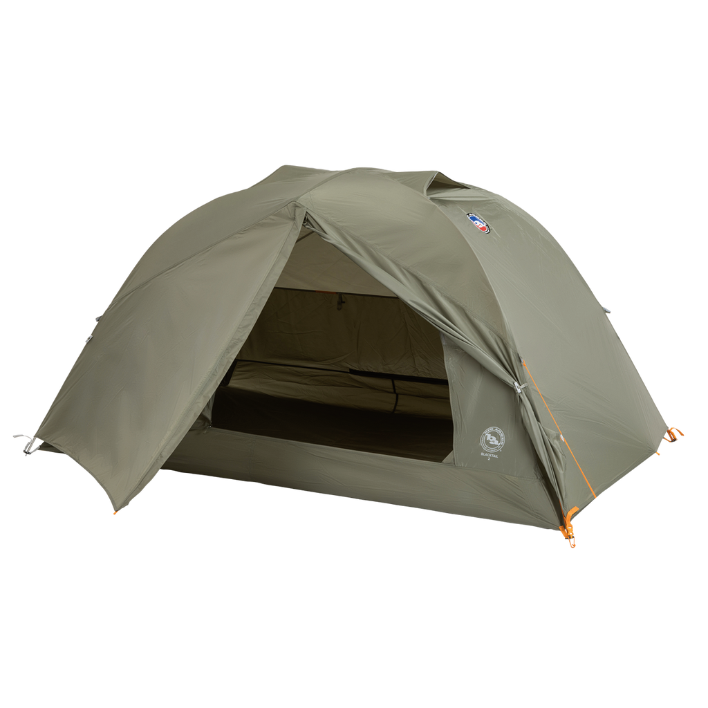 A green, dome-shaped Big Agnes Returns Blacktail 2 - Vetiver tent is pitched with its front entrance open to reveal the interior. This lightweight backpacking tent stands on a plain white background.